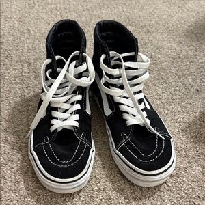 Women’s Vans Black and White High-Top Sneakers